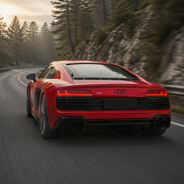 Chase-Car Shot — The camera follows behind another moving vehicle, creating a pursuit-like view with strong forward momentum and roadway context