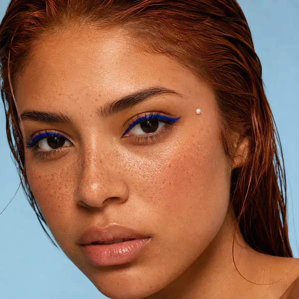 Beauty editorial — Beauty editorial photography highlights makeup, hair, skin, and expressive facial details with polished close-range lighting